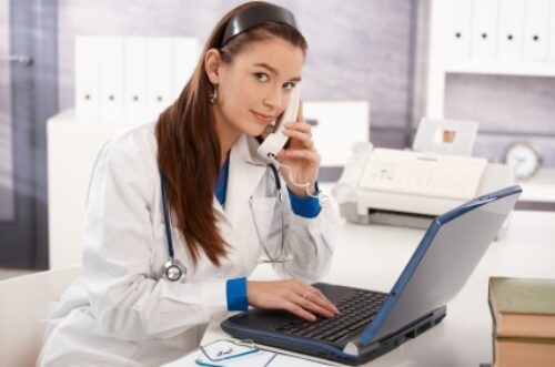 Portrait of young female doctor at office